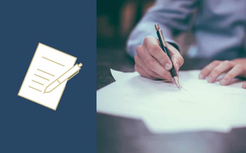 man taking notes with pen